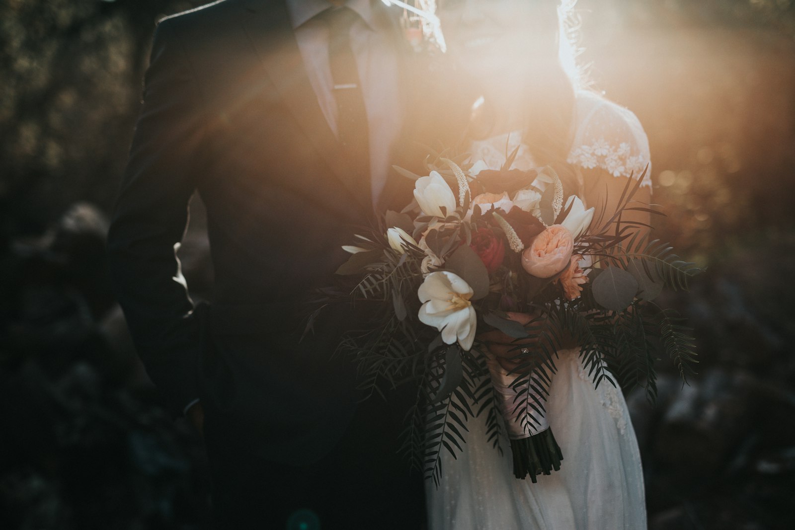 Niamh and Conor at golden hour, Niamh holding her bouquet